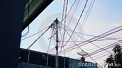 Power poles with messy wires Stock Photo