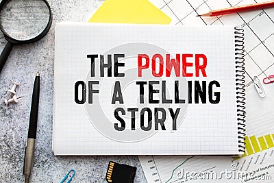 THE POWER OF STORYTELLING - text on notepad on wooden desk Stock Photo