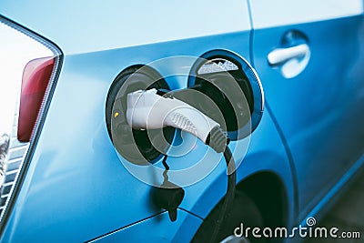 Power supply connect to electric vehicle Stock Photo