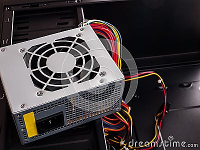Power supply for a stationary desktop computer with wires for connecting to the motherboard, power supply for the board, processor Stock Photo
