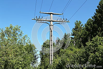 Power transmission masts against a blue sky Stock Photo