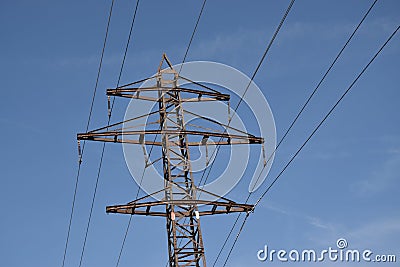 Power transmission tower on background of blue sky Stock Photo