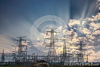 Power transmission tower and sun rays Stock Photo