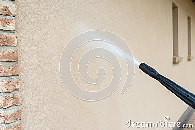 Power washing the wall - cleaning facade of the house Stock Photo