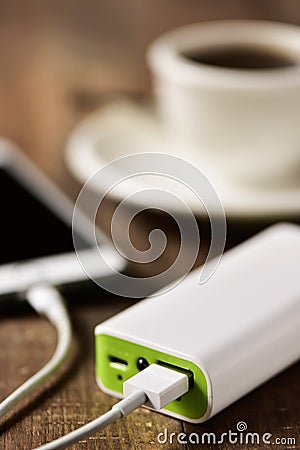 Powerbank charging a smartphone Stock Photo