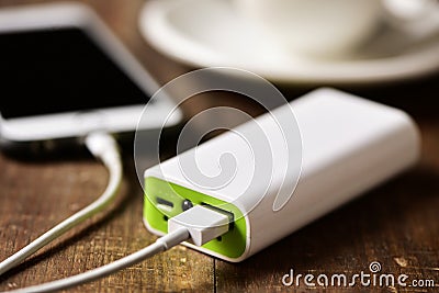 Powerbank charging a smartphone Stock Photo