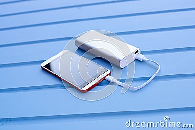 Powerbank charging smartphone Stock Photo