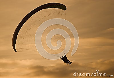 Powered parachute at sunset Stock Photo