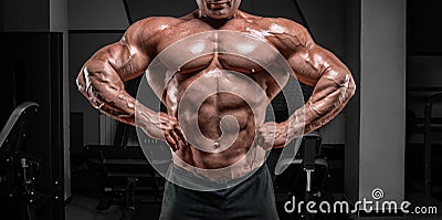 Powerful bodybuilder posing in the gym. No name portrait. Bodybuilding concept Stock Photo