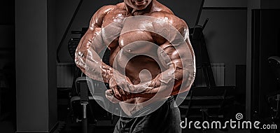 Powerful bodybuilder posing in the gym. No name portrait. Bodybuilding concept Stock Photo