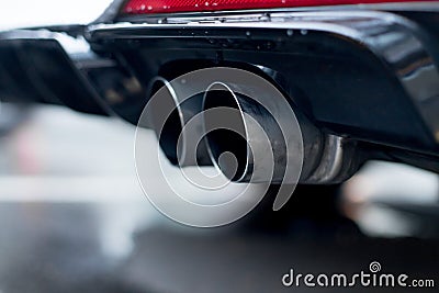 Powerful car with exhaust pipe, pollution and fine dust Stock Photo