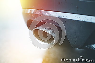Powerful car with exhaust pipe, pollution and fine dust. Sunlight Stock Photo