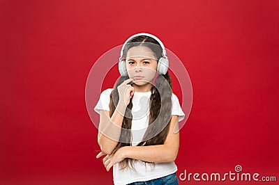 Powerful effect music teenagers their emotions, perception of world. Girl listen music headphones on red background Stock Photo