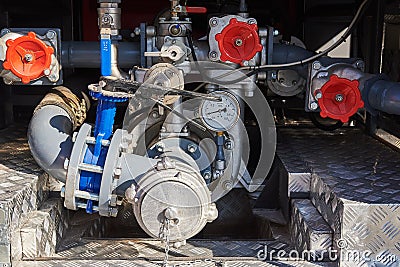 Powerful fire engine pump with water pressure control devices and valves Stock Photo