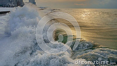 Powerful green foamy wave crushing on a shore Stock Photo