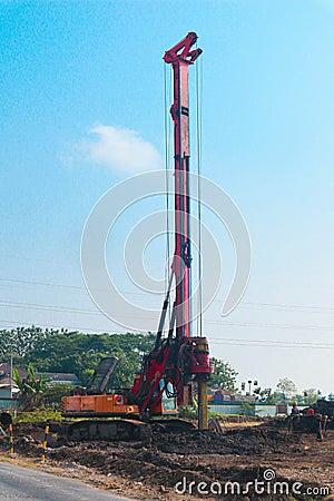 Powerful hydraulic machine drilling rig on a construction site. Installation of bored piles by drilling. Pile foundations. Stock Photo