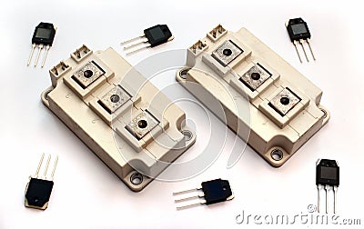 Powerful IGBT transistor modules and small transistors on white Stock Photo