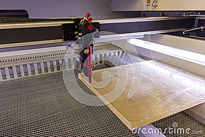 Powerful laser cuts Plexiglas 10 mm Stock Photo