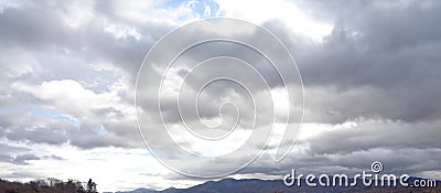 Powerful Rainstorm Coming Up Over Mountain Ridge Stock Photo