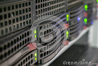 A powerful server is located in the computer room of the computer center. Computing center for data processing. Green LED lights Stock Photo