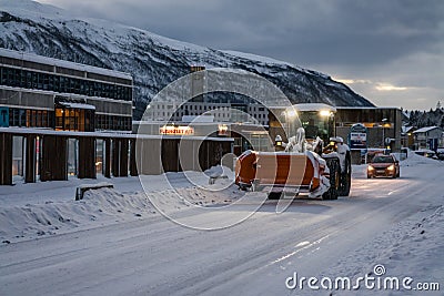 Powerful snowplough clearing residential roads Editorial Stock Photo