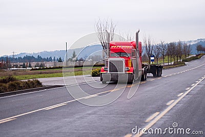 Powerful stylish classic semi truck with vertical exhaust pipes Stock Photo