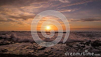 Powerful wave and sunrise Stock Photo