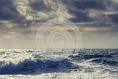 Powerful waves in the ocean and rough stone coast line. West of Ireland. Cloudy sky. Irish landscape scene. Power of nature Stock Photo
