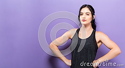 Powerful young fit woman on a solid background Stock Photo