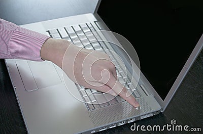 Powering On or Off a Laptop Computer Stock Photo