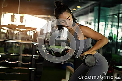 powerlifting and people sporty woman exercising with barbell in gym. exercise sport woman in fitness. Stock Photo