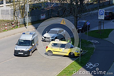 Poznan, Poland - April 21, 2023: A police inspector checks the documents of a taxi driver Editorial Stock Photo