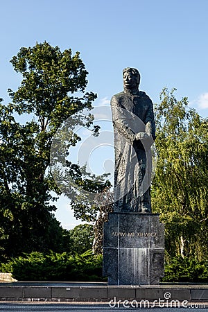 Statue of Adam Mickiewicz, Polish poet, dramatist, and essayist at Adam Mickiewicz Statue in center of Poznan city, Poland Editorial Stock Photo