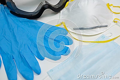 PPE personal protective equipment for medical use or virus prevention on white table. Stock Photo