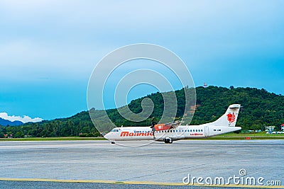 The PR PDO propeller-driven passenger aircraft prepares for takeoff at the airport on the island of Langkawi Editorial Stock Photo