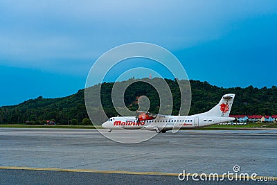 The PR PDO propeller-driven passenger aircraft prepares for takeoff at the airport on the island of Langkawi Editorial Stock Photo