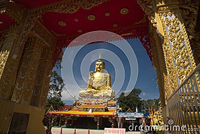 Pra Put Ratanamani Srihathai Naresuan large golden sitting outdoor Buddha in Wat Maniwong. Editorial Stock Photo