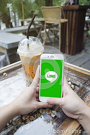 Prachuapkhirikhan,thailand-august 6,2016: woman hand holding Apple iPhone 6 plus with Line application on screen Editorial Stock Photo