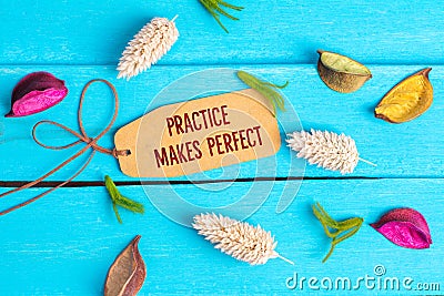 Practice makes perfect text on paper tag Stock Photo