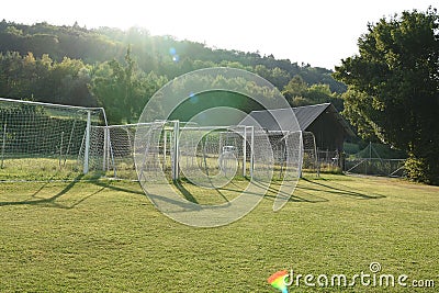 Practice portable football or soccer goals neatly arranged and lying near a football playground Stock Photo