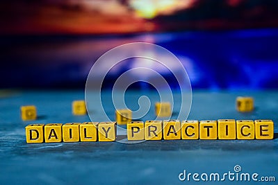 Daily Practice on wooden blocks. Cross processed image with bokeh background Stock Photo