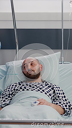 Practitioner nurse monitoring patient during sickness recovery writing disease symptom Stock Photo