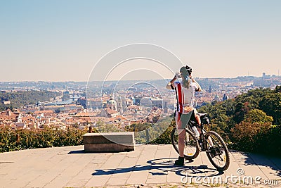 Prague city panorama view and cyclist in Czech Editorial Stock Photo