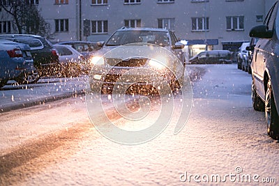 Prague city street under the snow. Cars driving on a blizzard road. Snow calamity in the city. Snow covered cars. Winter Stock Photo