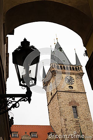 Prague Clock tower and street lamp on a cloudy day in autumn Editorial Stock Photo