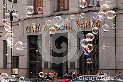 PRAGUE, CZECH REPUBLIC - APRIL 21, 2017: The building of the Czech National Bank, with colorful bubbles floating around Editorial Stock Photo