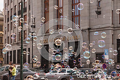 PRAGUE, CZECH REPUBLIC - APRIL 21, 2017: The building of the Czech National Bank, with colorful bubbles floating around Editorial Stock Photo