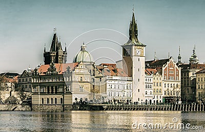 Prague Czech Republic April 27, 2017. Karlov Bridge Clock Tower view from the river Vltava toning vintage postcard Editorial Stock Photo