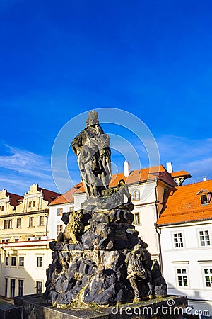 Prague, Czech Republic - December 31, 2017:Prague, Czech Republic: Statue of Vitus on the north side of Charles Bridge Editorial Stock Photo