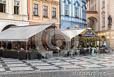 Prague - Czech Republic - Empty cafe terraces during a rainy day at the central market Square in Old Town Editorial Stock Photo